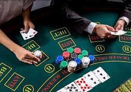 Close-up of Texas Hold'em Bonus cards and chips on jayabola ink